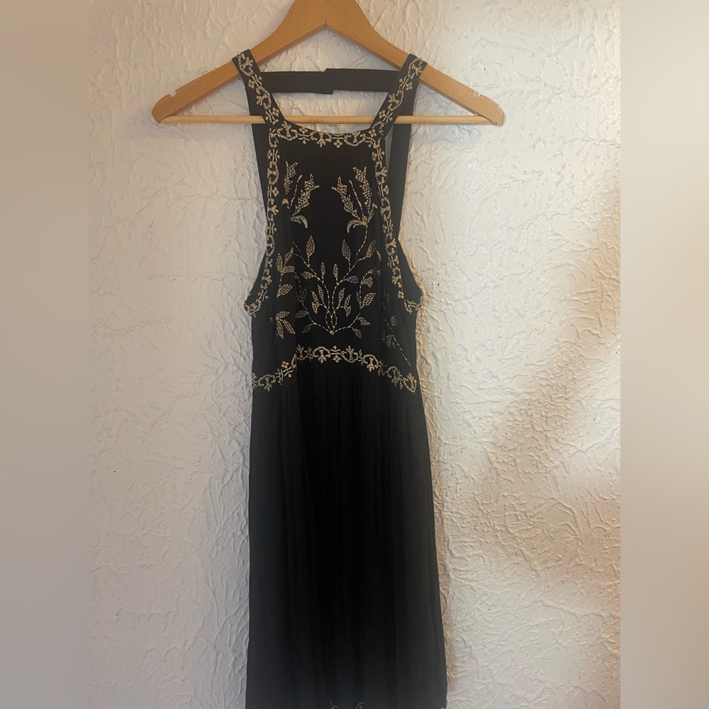 Black Urban Outfitters mini dress (size M) with gold embroidery.